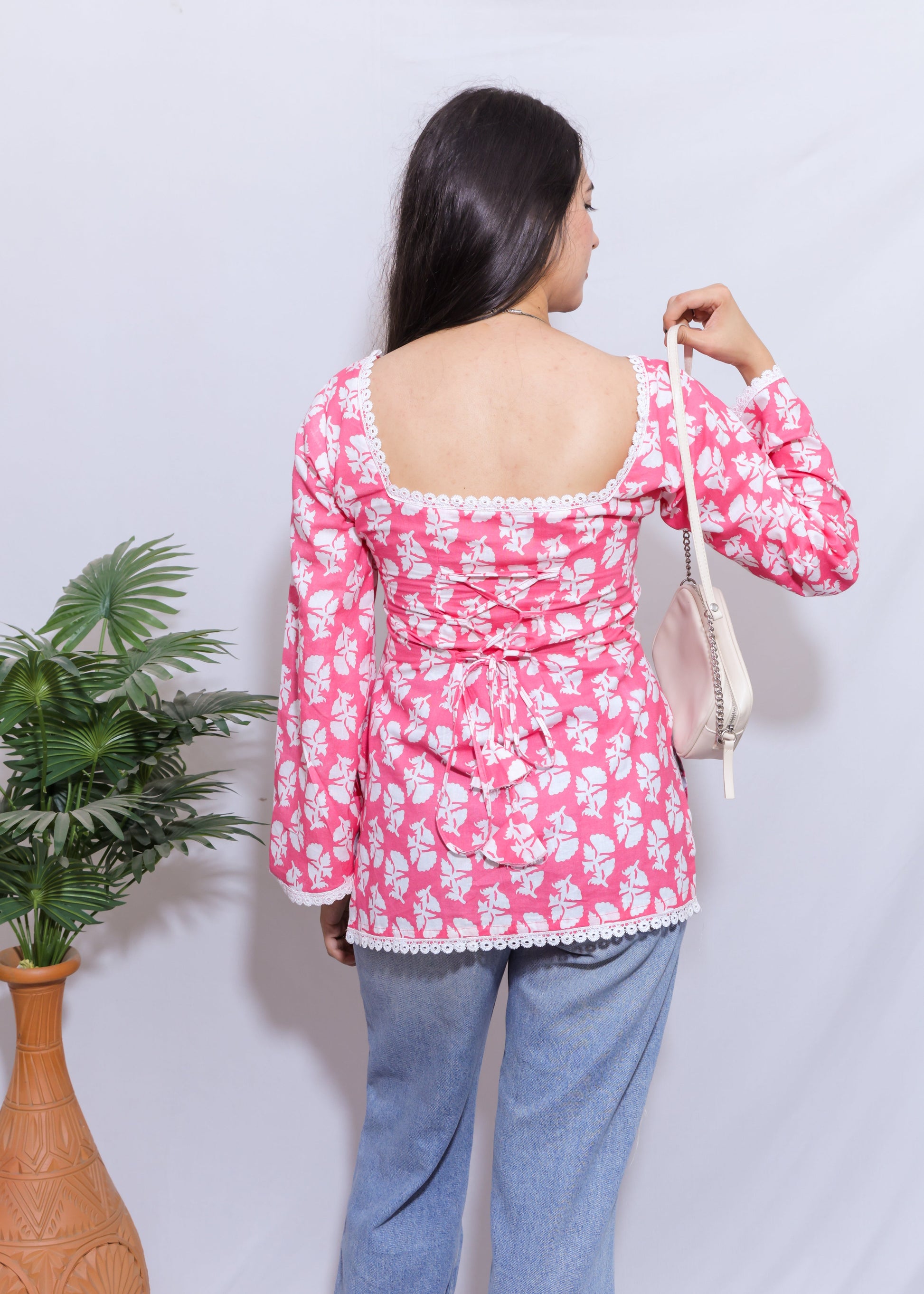 pink full sleeved short kurti with corset-style back