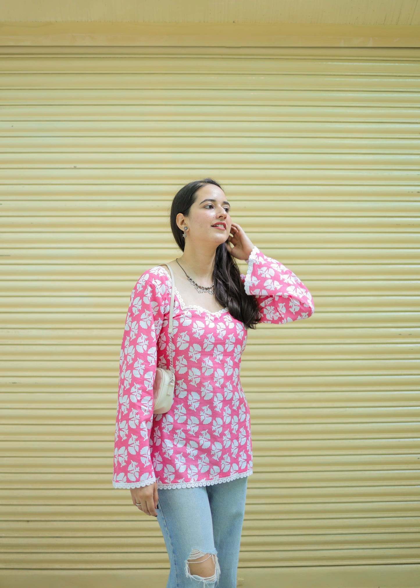 Pink full sleeved short kurti with lace detailing