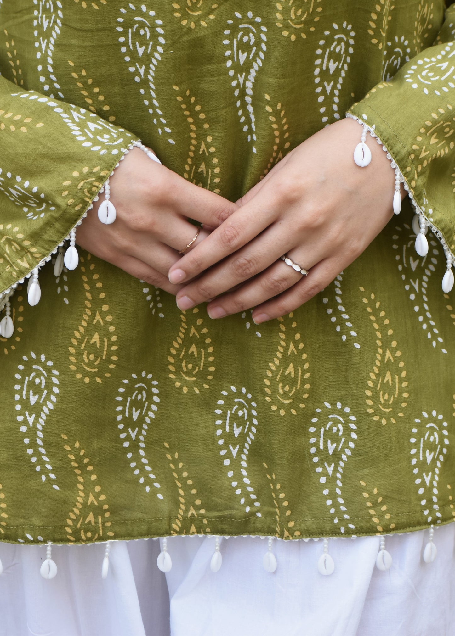 green paisley print pakistani sleeved short kurti with shell detailing