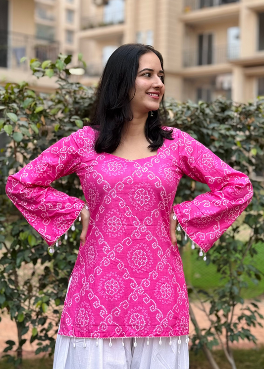 Pink Bandhani bell sleeved kurti along with shell detailing